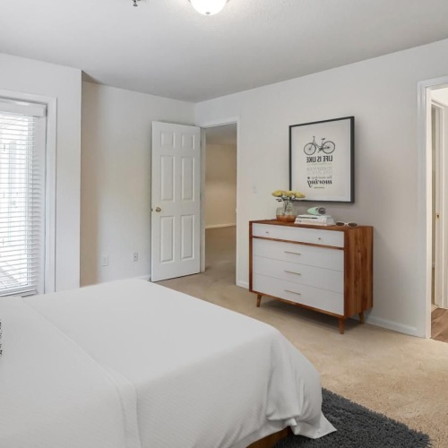 a living room with white furniture
