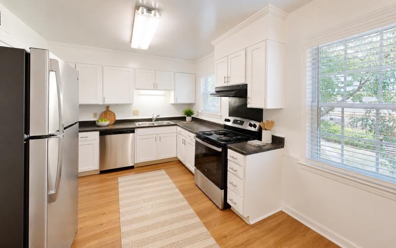 a kitchen with white cabinets
